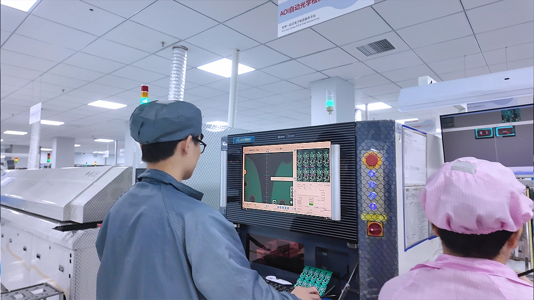 Engineer performing AOI circuit testing on an automotive electronic unit