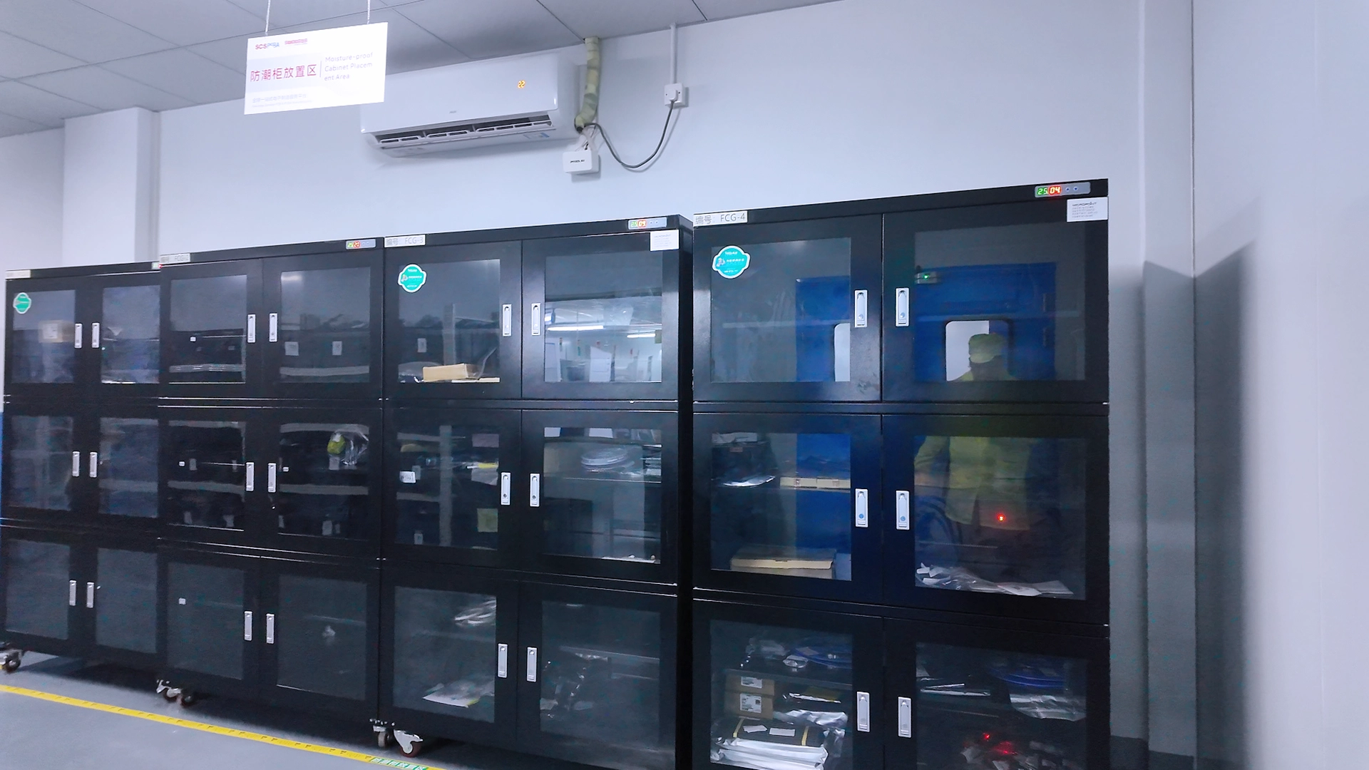 Moisture-proof cabinet stocked with electronic components, indicating controlled-moisture storage for pcb board parts