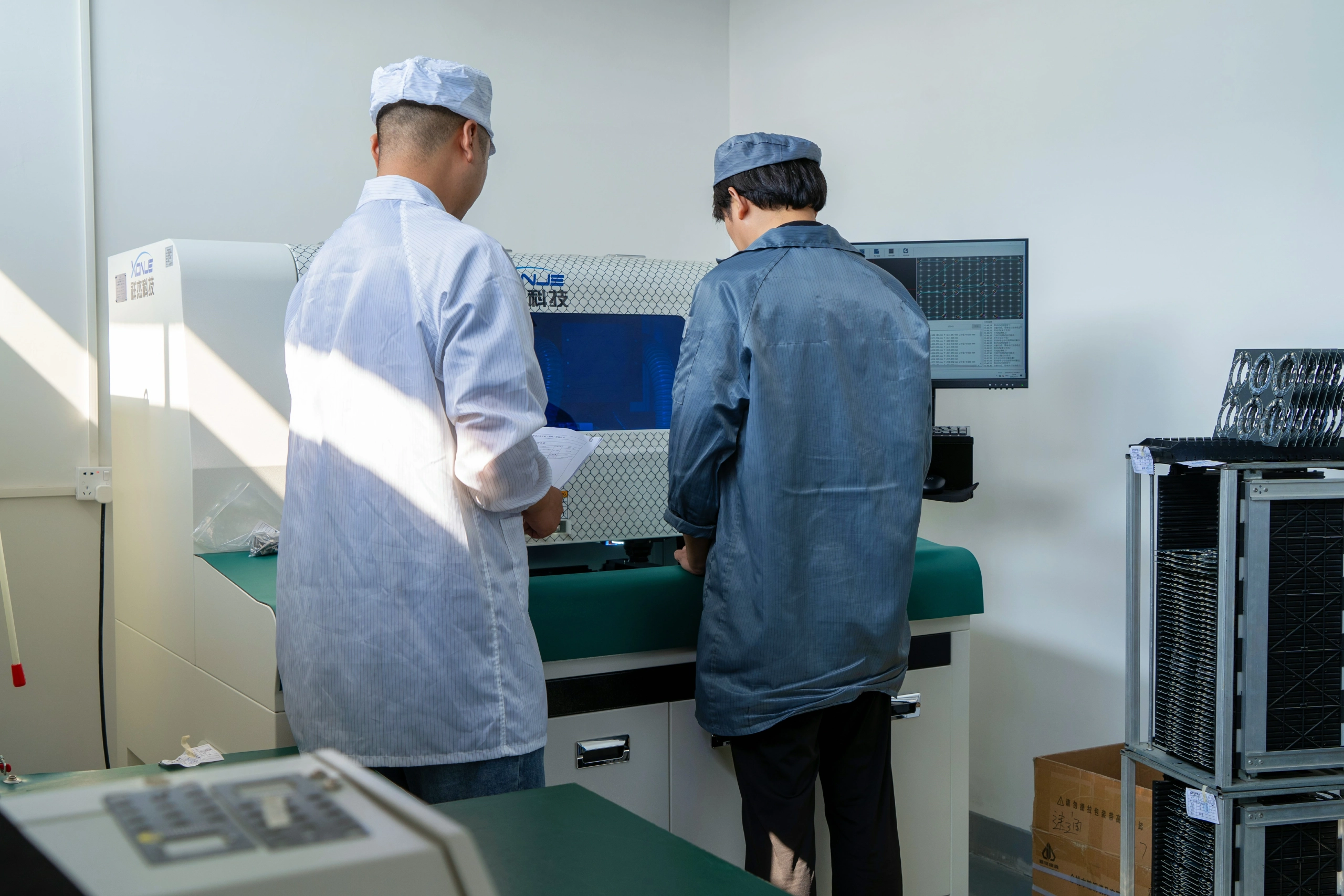 operator reviewing inspection results for circuit board quality