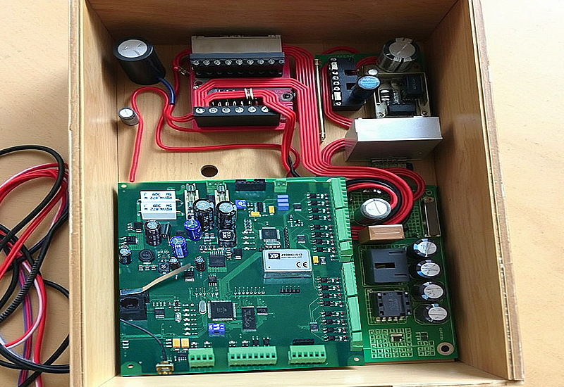 The box build assembly includes printed circuit boards, various components, and cables