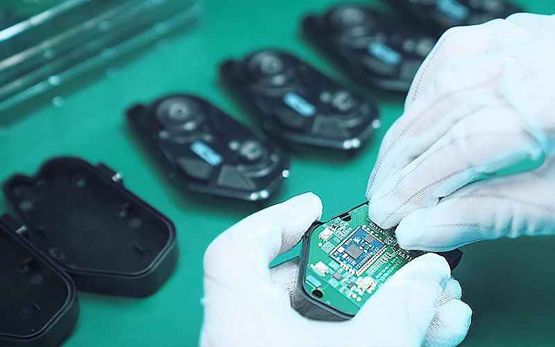 Box build assembly integrating PCBAs into electronic product enclosure with wiring and connectors