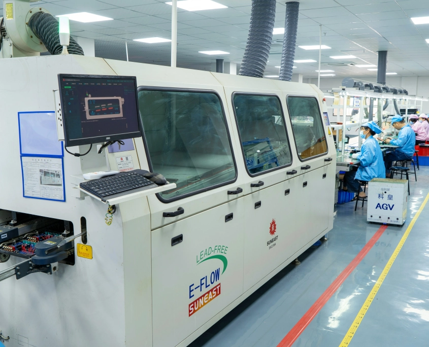 Technicians performing box build assembly and mechanical integration on production line
