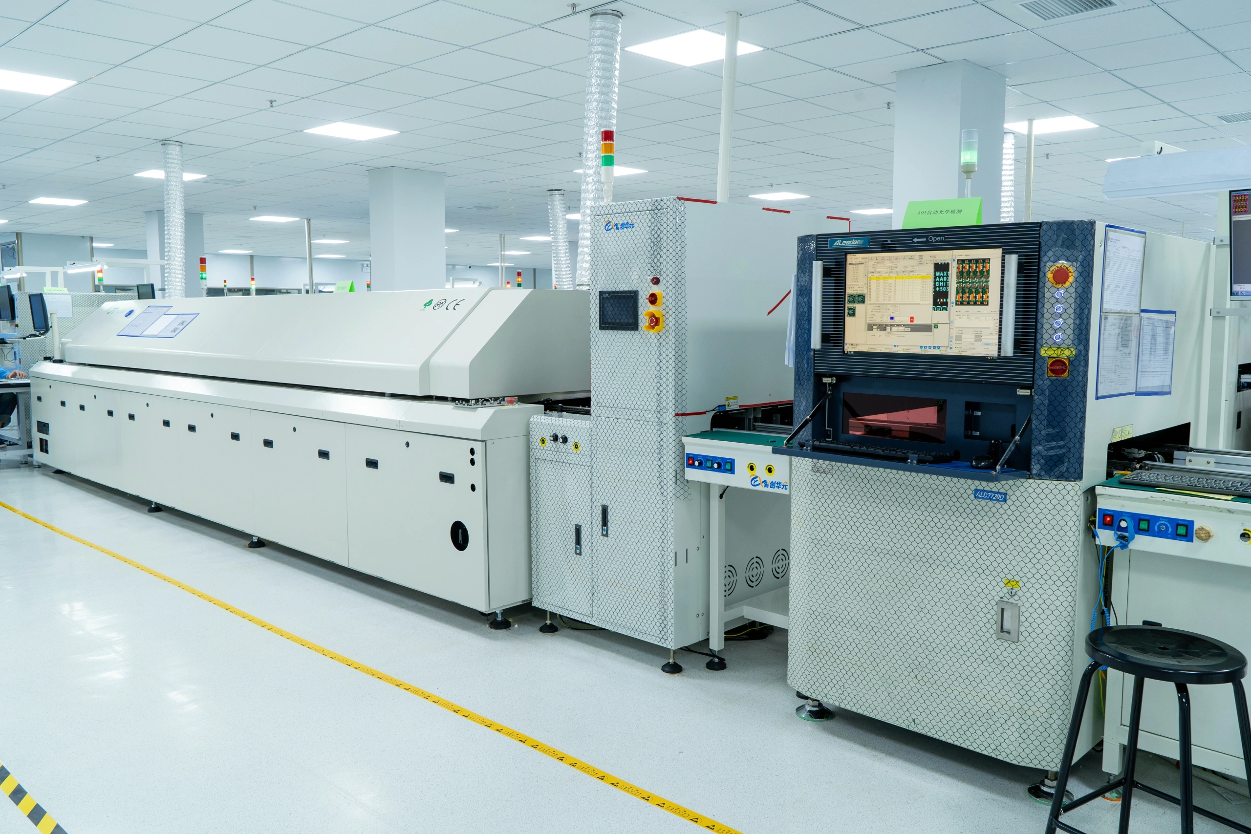 PCB assembly factory floor with assembly and SMT production lines