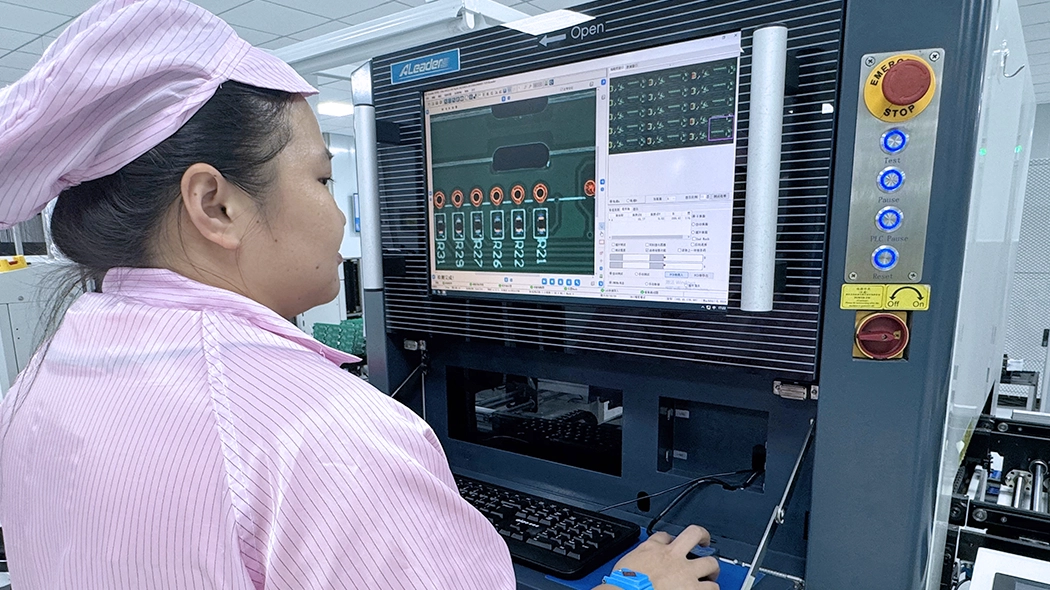 Engineers inspect printed circuit assembly under AOI