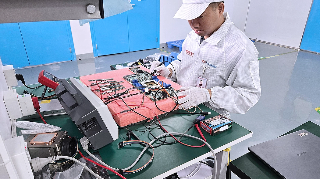 Engineers are conducting comprehensive testing on a PCBA failure